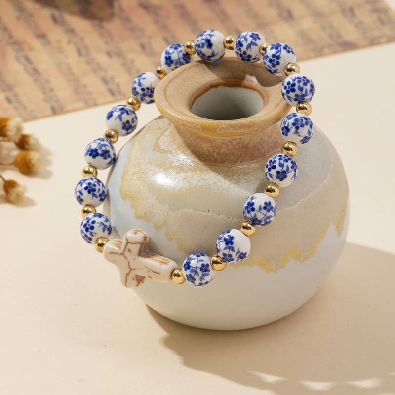 Wall to Wall by Josslyn BLUE CERAMIC PORCELAIN CROSS CHARM BRACELET
