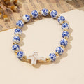 Wall to Wall by Josslyn BLUE CERAMIC PORCELAIN CROSS CHARM BRACELET