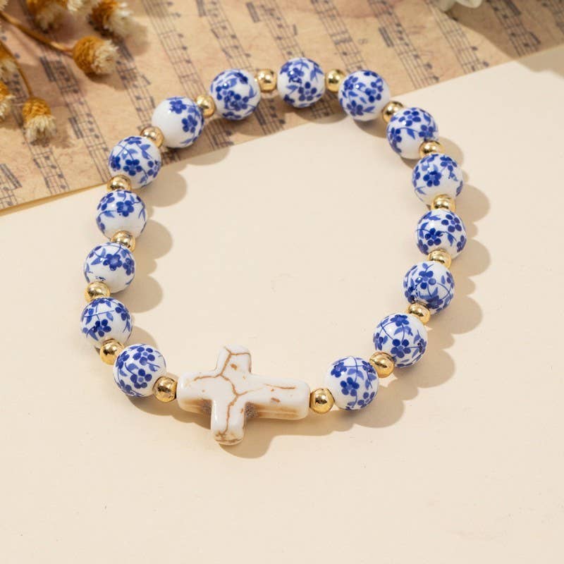 Wall to Wall by Josslyn BLUE CERAMIC PORCELAIN CROSS CHARM BRACELET