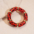 Wall to Wall by Josslyn Acrylic Leopard Animal Gold Stretch Cord Bracelet | Red